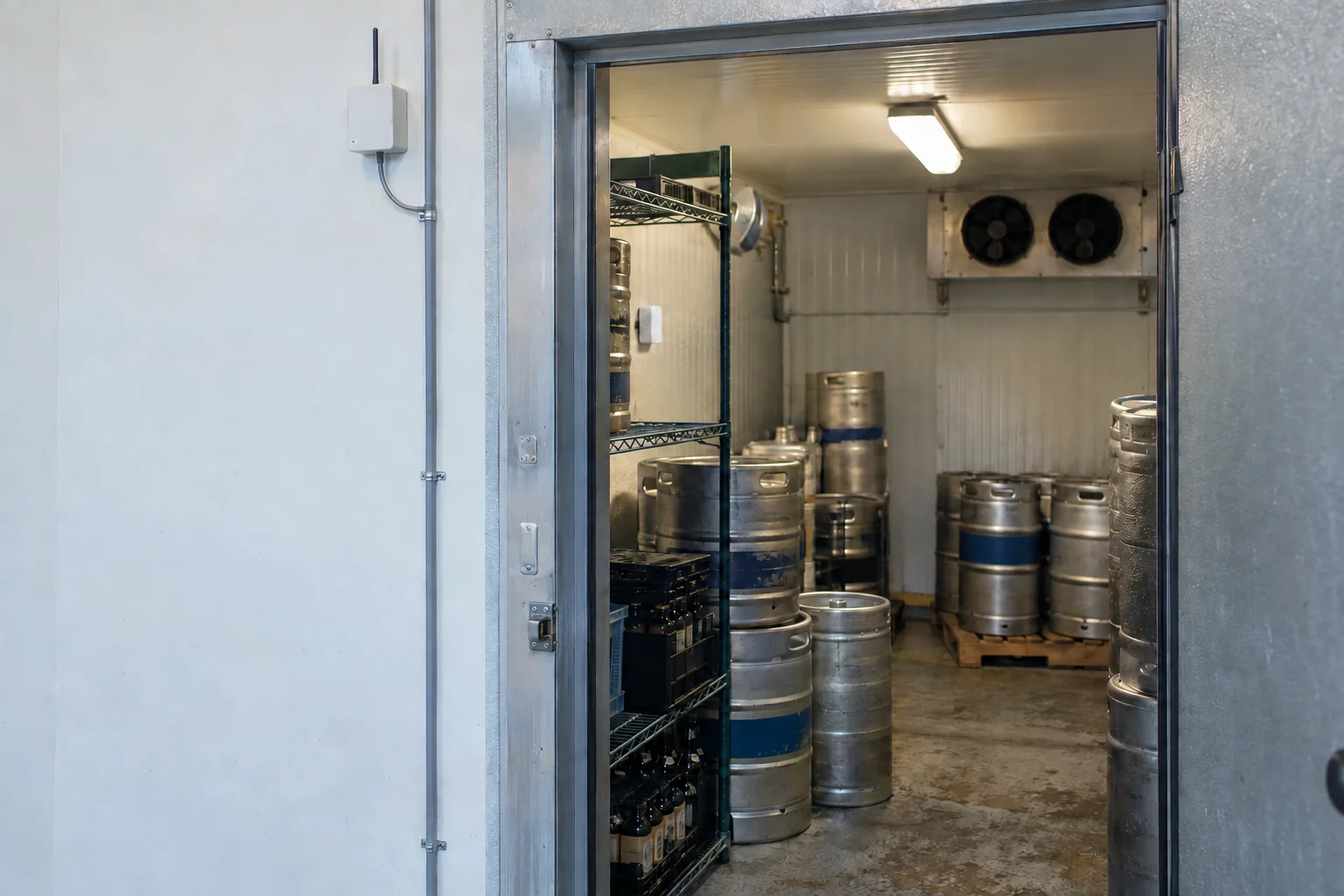 Temperature sensor inside a brewery cold room, with a gateway on the outside wall